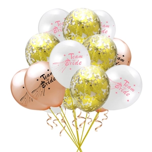 Detail of Team Bride rose gold confetti balloons with white and metallic party decorations