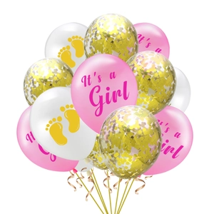 Detail of pink It's a Girl balloons with gold confetti and cute footprint patterns