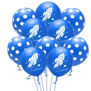 Close-up of blue astronaut rocket balloons and agate polka dot balloons for party decor