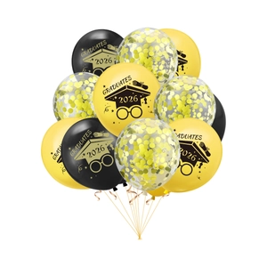 Detailed view of 2026 graduation balloons with gold confetti and black print designs