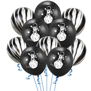 Detail of space-themed balloons with astronaut prints and black striped patterns