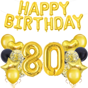 Close-up of gold number 80 and Happy Birthday foil balloons for party decoration