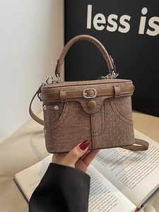 Chic brown box handbag with creative retro trouser-style stitching and a top handle