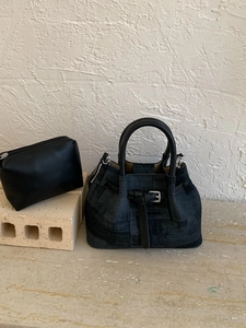 Retro denim bucket bag with black leather handles and matching inner pouch set