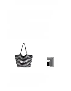 Striped tote bag size comparison showing capacity for a tablet and smartphone
