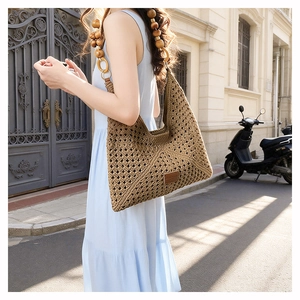 Macro detail of dark brown woven tote with bohemian wooden bead handle and wave texture