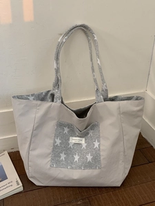 Large striped tote bag with star print and logo patch for campus and daily use