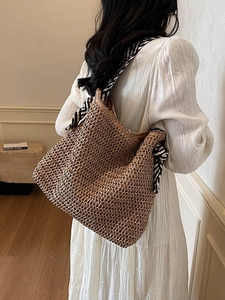 Woven straw shoulder bag with elegant tote with silk scarf handle for summer beach vacation