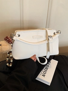 White faux leather crossbody square bag with vertical stitching and cute bear charm pendant