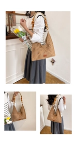Detailed close-up of the hollow woven tote bag featuring round wooden bead handles