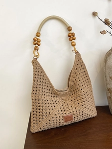 Handwoven hollow tote bag with wooden beads and crochet diamond pattern for beach vacation
