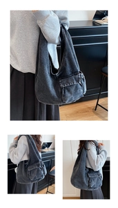 Detail of vintage denim tote bag with two front cargo pockets and wide shoulder straps