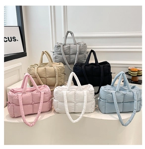 Detailed grid showing multi-color quilted puffer tote bags with side drawstring detail