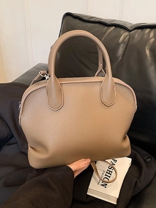 Chic taupe litchi grain shell handbag with dual handles and detachable shoulder strap