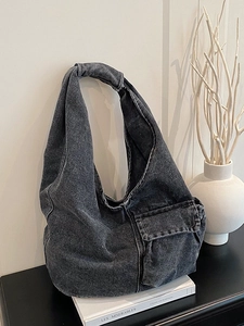 Retro washed denim tote bag in dark grey with knotted shoulder strap and front pocket