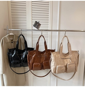 Three crocodile texture tote bags in black, tan, and beige with multiple front zipper pockets