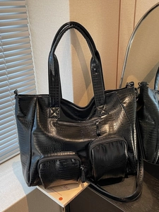 Large black crocodile pattern tote bag with multi-pocket design for shoulder and handbag use