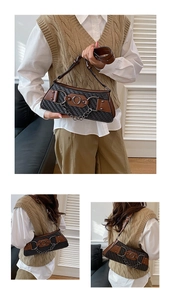 Detail of vintage woven crossbody bag with silver metal ring and chain embellishments
