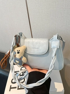 Chic light blue square shoulder bag with woven strap and cute teddy bear pendant