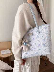 Chic light blue tote bag with cute cartoon bear prints and plush puppy pendant accessory