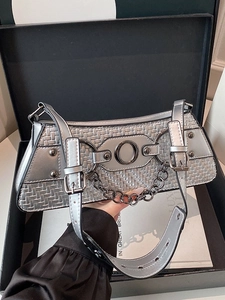 Silver woven baguette bag with oversized metal ring and adjustable strap detail