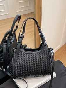 Classic black woven tote bag in high-quality faux leather with golden hardware accents