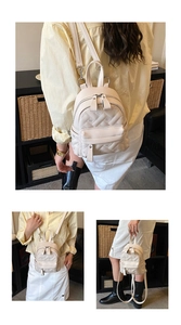 Detailed views of the white PU mini backpack showing hand-held and crossbody carrying modes
