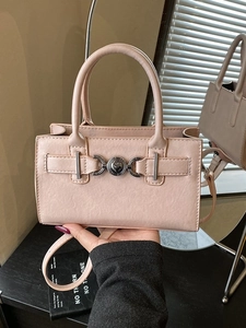 Pink minimalist rectangular handbag with heart metal clasp and adjustable strap