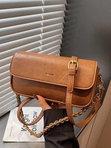 Vintage brown leather baguette bag with 'NO FILTER' gold lettering and dual straps
