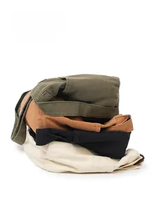 Pile of four twill cotton casual trousers in green, brown, black and cream colors