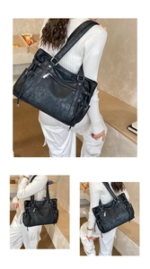 Detail of a large black tote bag showing lychee texture leather and side drawstring pockets