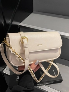 Minimalist beige leather baguette bag with gold NO FILTER print and metal chain strap
