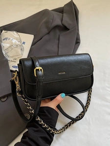 Minimalist black baguette bag with gold NO FILTER print and elegant chain strap