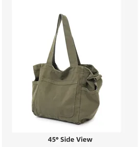 45-degree side view of an olive green canvas tote bag with functional side storage pockets