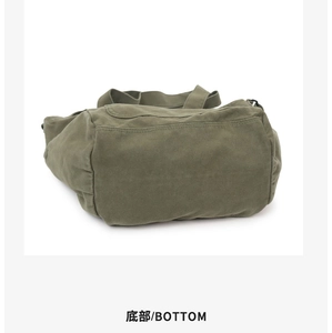 Detail view of the reinforced bottom stitching on this army green canvas tote bag