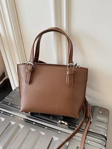 Minimalist dark brown litchi pattern leather tote bag with dual handles and silver hardware