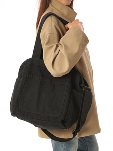 Retro black canvas tote bag with adjustable strap and side pockets for casual daily use