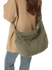 Olive green large canvas crossbody bag with multiple pockets and retro casual style