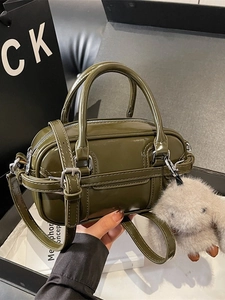 Olive green glossy patent leather mini Boston bag with plush rabbit charm and crossbody strap