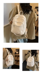 Chic beige faux leather backpack with pom-pom charm and large capacity for daily commute