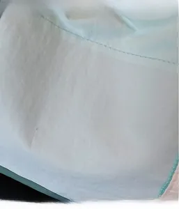 Close-up of light blue nylon tote bag fabric featuring a textured micro-wrinkle finish