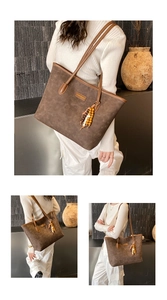 Detail of dark brown tote bag with circular embossing and decorative beaded tassels