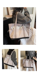 Detail of lavender tote bag featuring side drawstring pocket and white YOUNG letter print