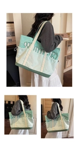 Detail of large canvas tote bag with green color-blocking and collegiate letter print