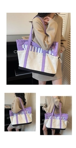 Detail of color-block canvas tote bag with large YOUNG letter print and wide strap