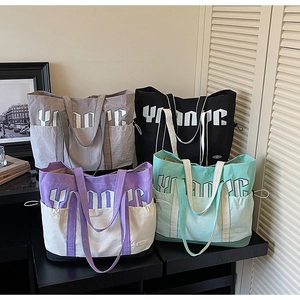 Multi-color large capacity nylon tote bags with Young lettering and side drawstring pockets