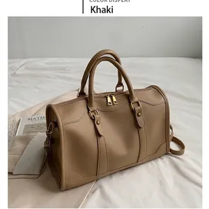 Minimalist khaki leather Boston handbag for women with urban shoulder bag design