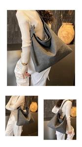 Detail of grey woven PU leather tote bag with star pendant and textured surface