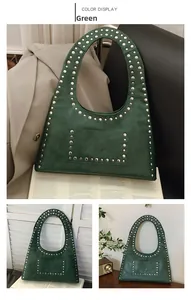 Detail of dark green vintage tote bag with metallic silver rivets and retro moto style