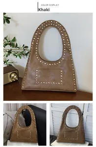 Detail of khaki hobo bag with vintage silver rivets and premium faux leather texture